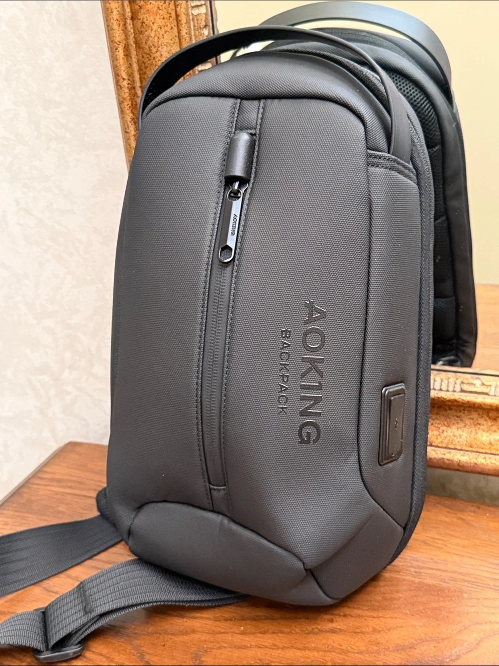 New without tag. Black Men’s Sling AOKING Backpack — Everyday Crossbody Carry.